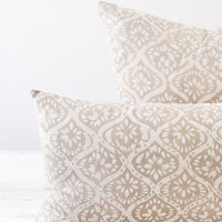 3: Detail shot of two light grey and white floral block printed pillows.