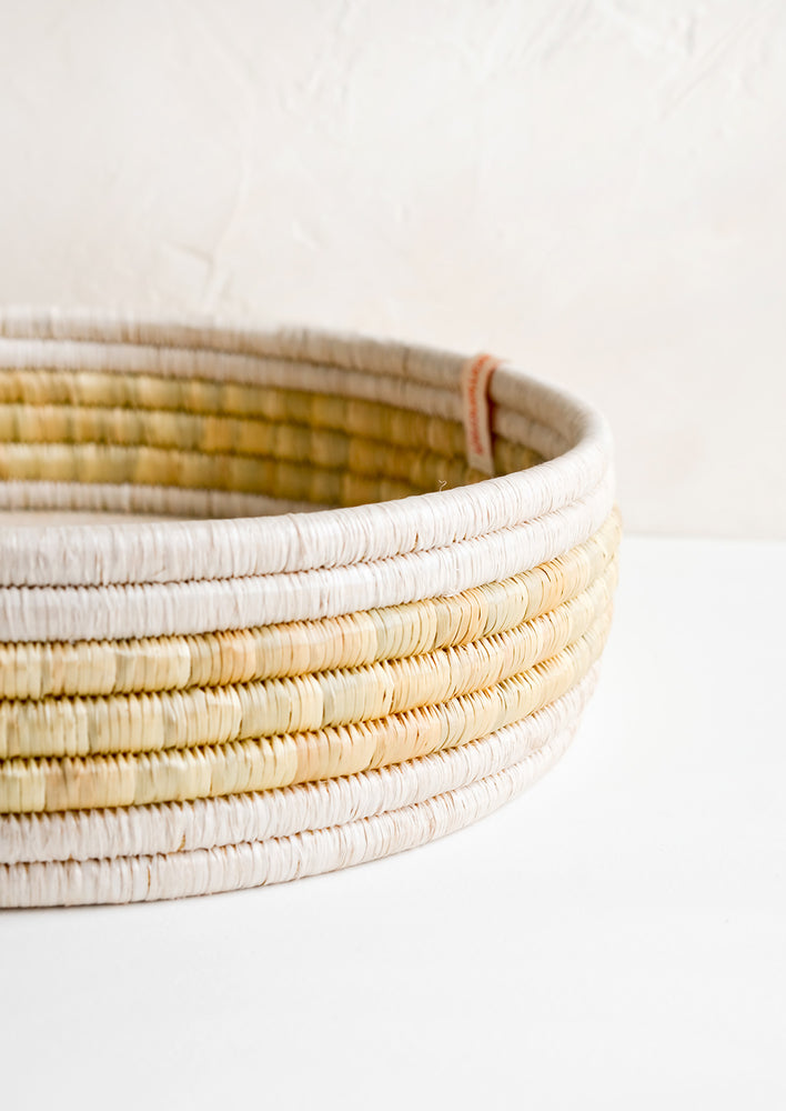 A tray made from woven seagrass.