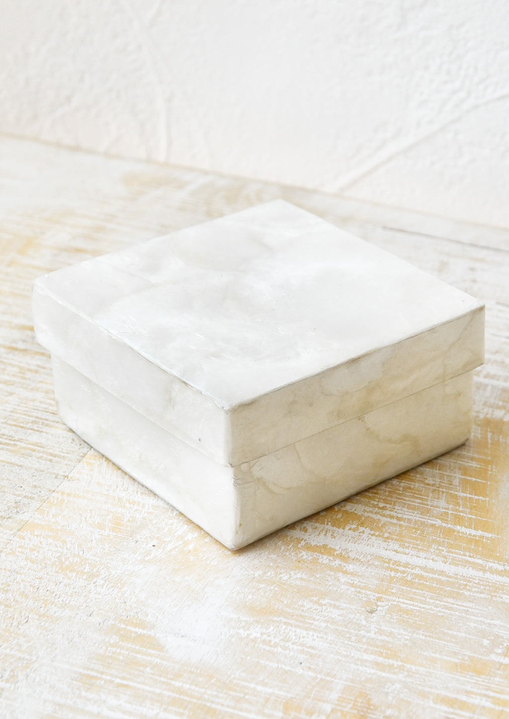 Natural Capiz: A small square box made from natural capiz.