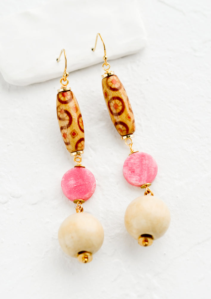 A pair of drop earrings made from Japanese wooden beads and pink agate.
