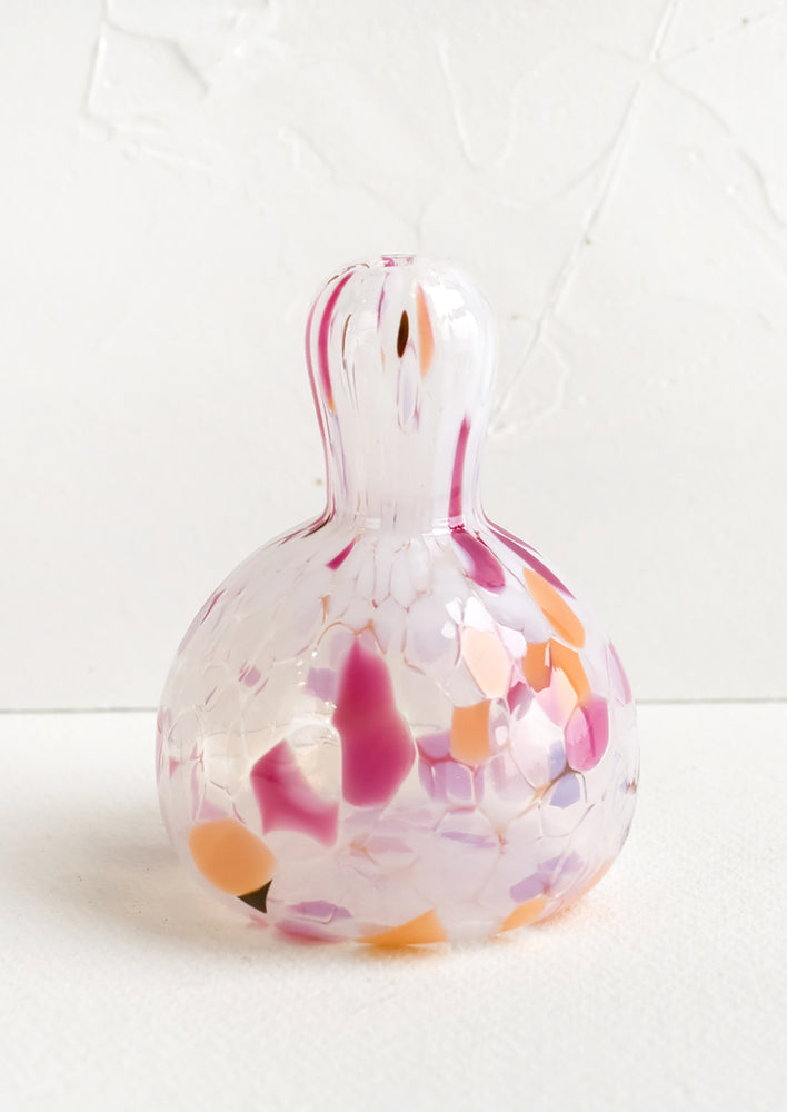 Gourd: A gourd shaped bud vase in glass with orange, brown and pink speckles.