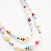 2: A mix of pearl, colorful plastic and gold metal beads on a double strand necklace