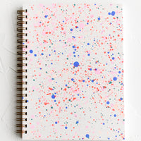 Journal: Spiral bound notepad with neon paint splatter cover.