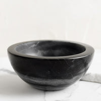 Black: A small black marble bowl.