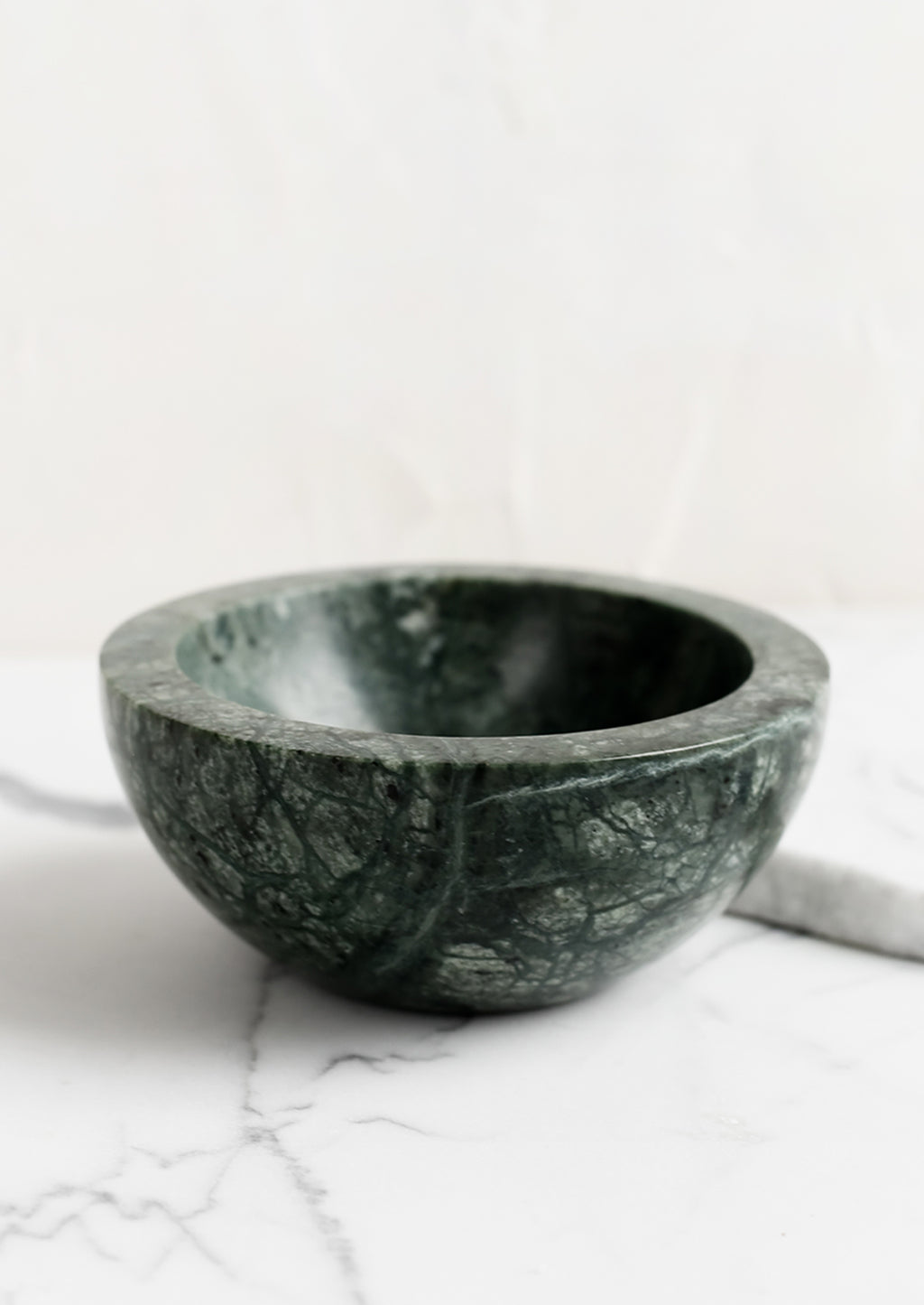 Green: A small green marble bowl.