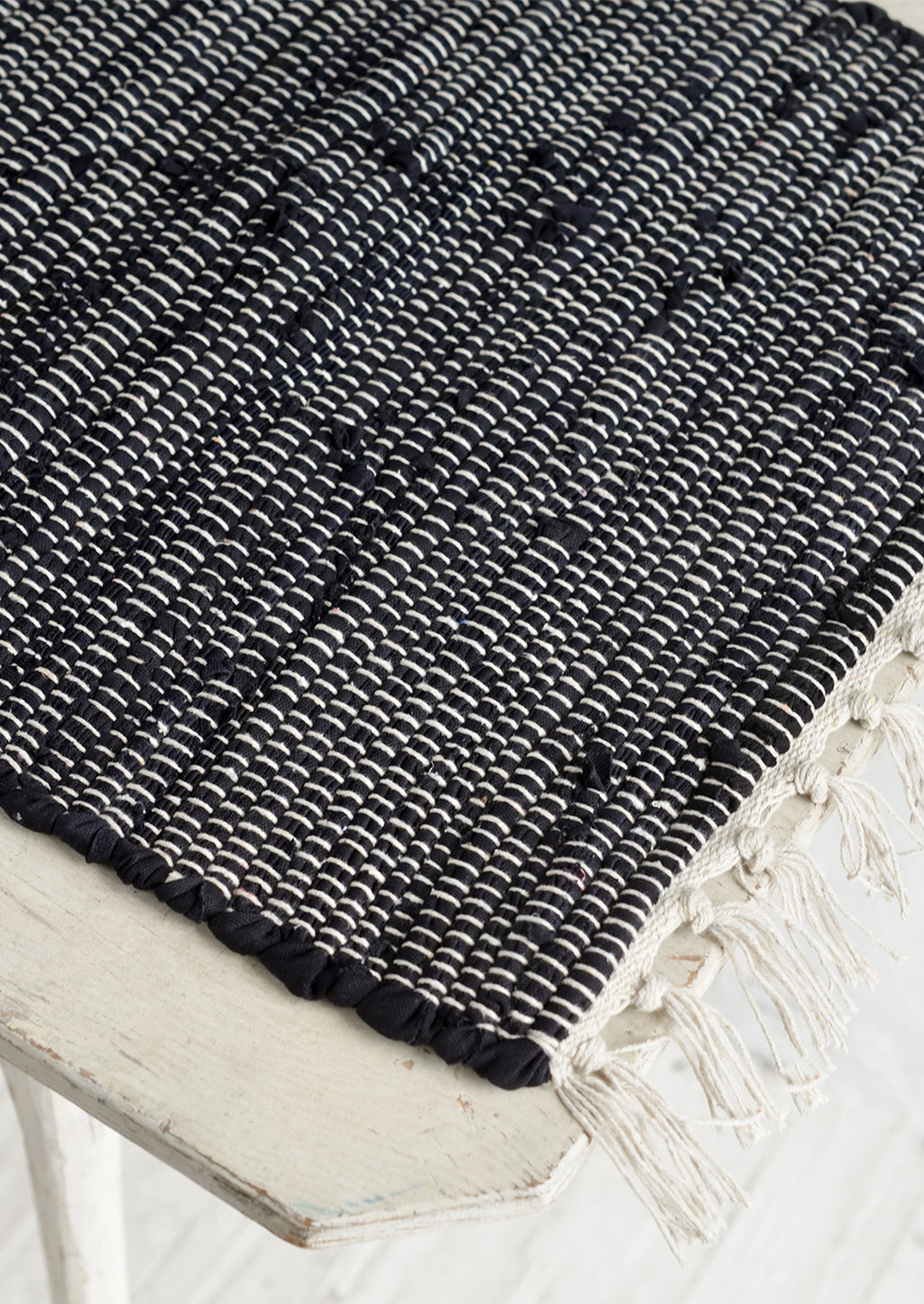 2: A black and white chindi weave table runner.