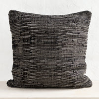 1: A black and white chindi weave throw pillow.