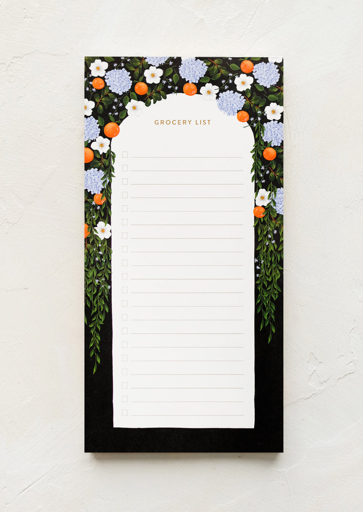 A grocery list notepad with citrus arch print.