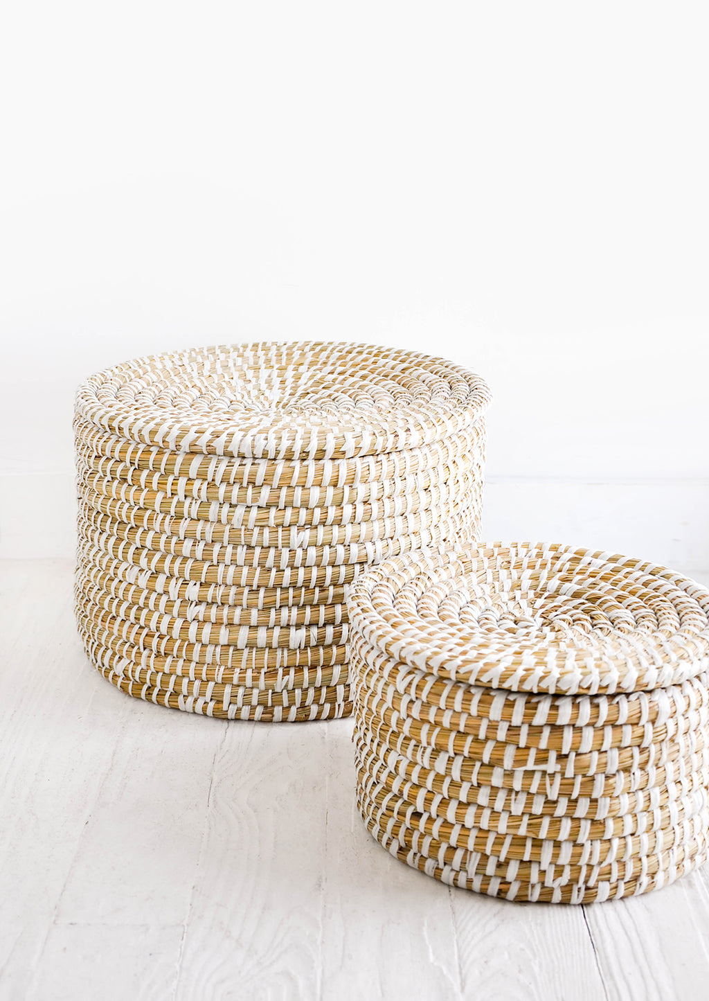 3: Small and large sizes of round, lidded seagrass baskets
