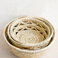 3: Nesting storage bowls made from woven palm leaf.