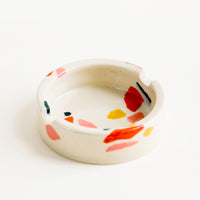 Warm Colors: Ceramic ashtray with allover hand painted terrazzo pattern in a variety of warm colors