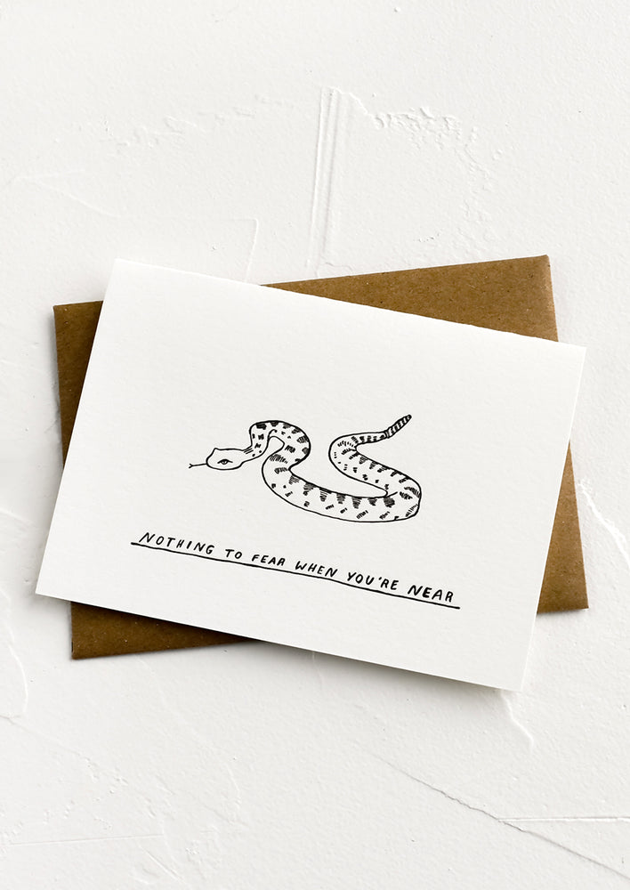 1: A greeting card with image of snake and text below reading "Nothing to fear when you're near".