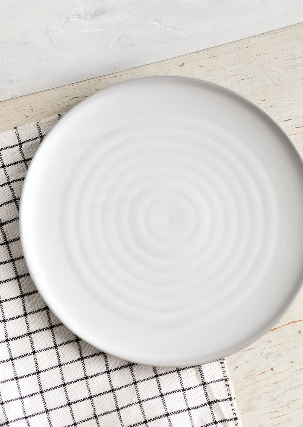 1: A round side plate with concentric circles pattern in soft grey glaze.