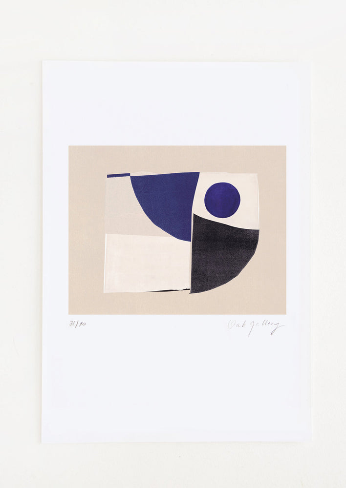 An abstract art print featuring a geometric composition in black, ivory, tan and navy blue.