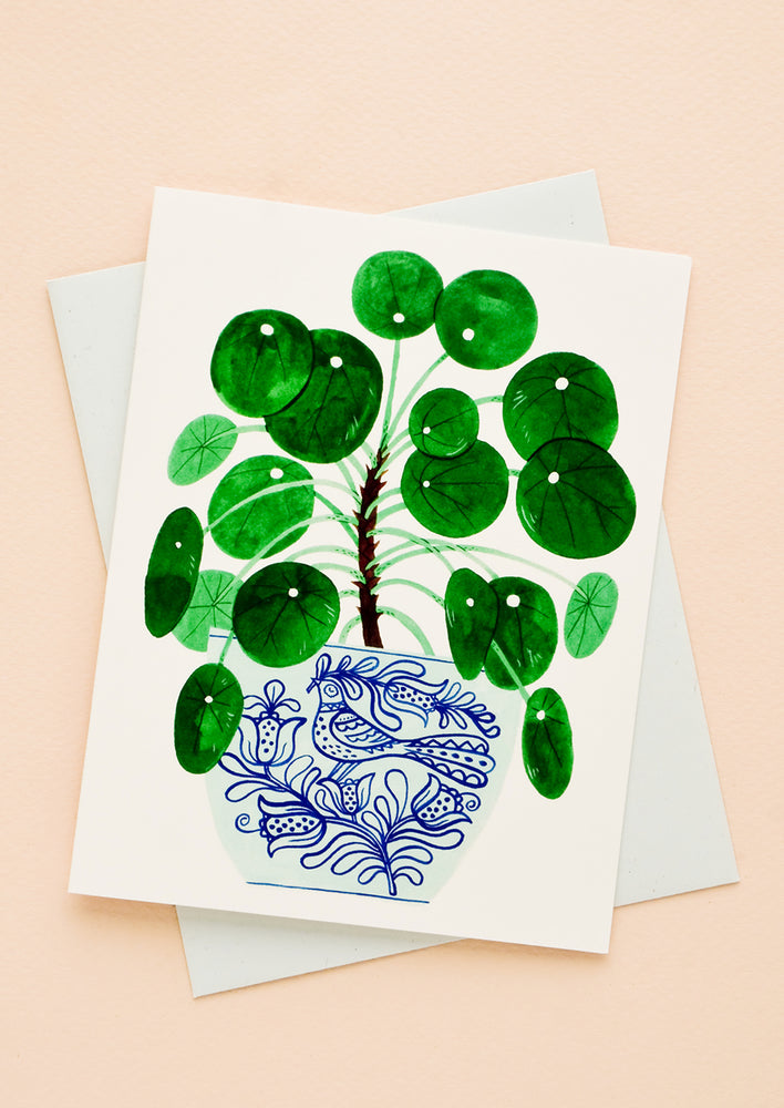 1: Greeting card with potted pilea plant printed on front, paired with light blue envelope