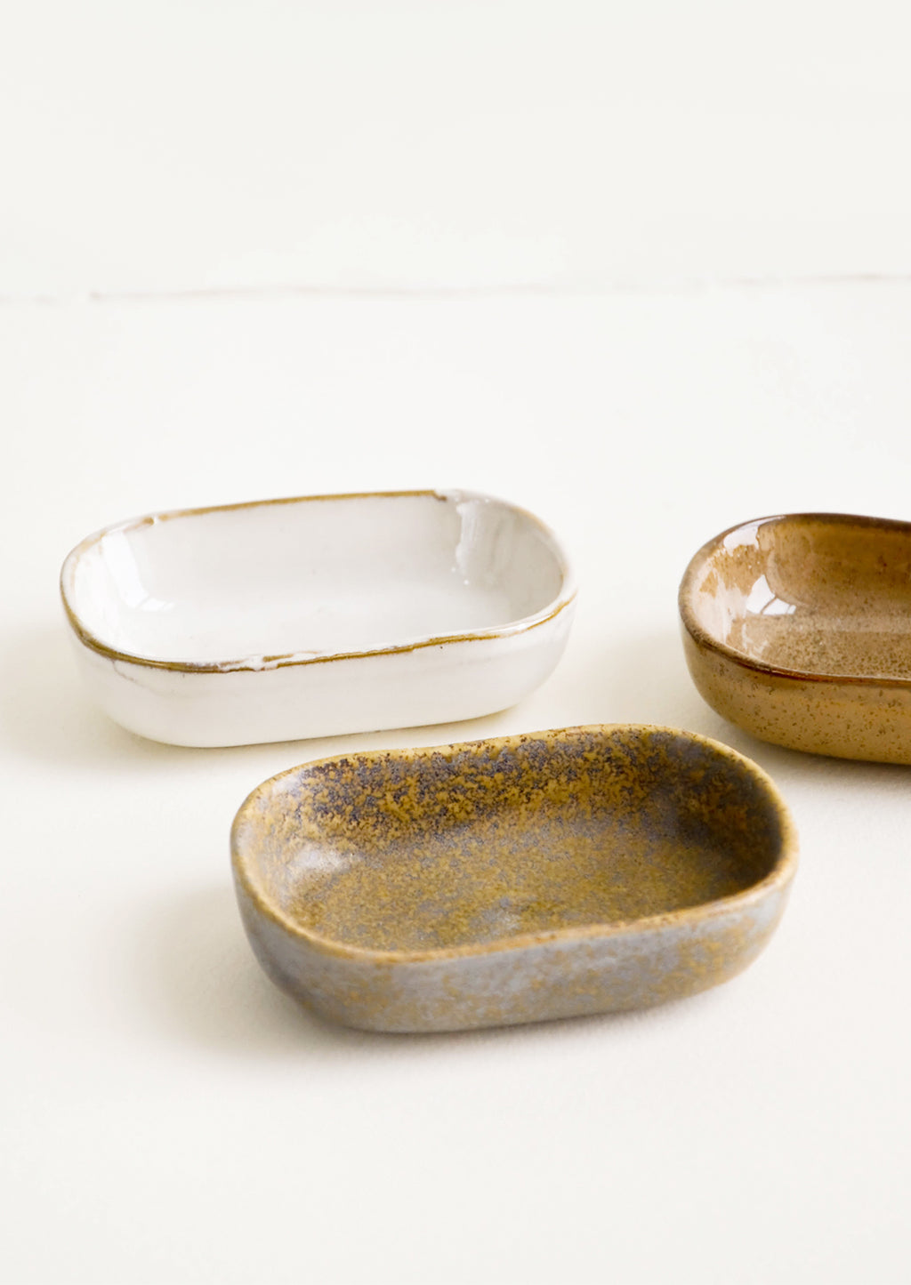 2: Trio of glossy ceramic Sauce Dishes in Earth Tones.