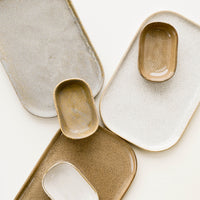 1: Array of Ceramic Trays & Sauce Dishes in Earth Tones.