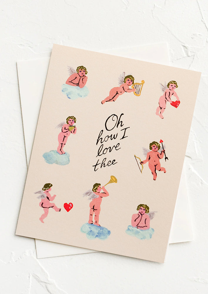 A card with cupid print reading "Oh how I love thee".