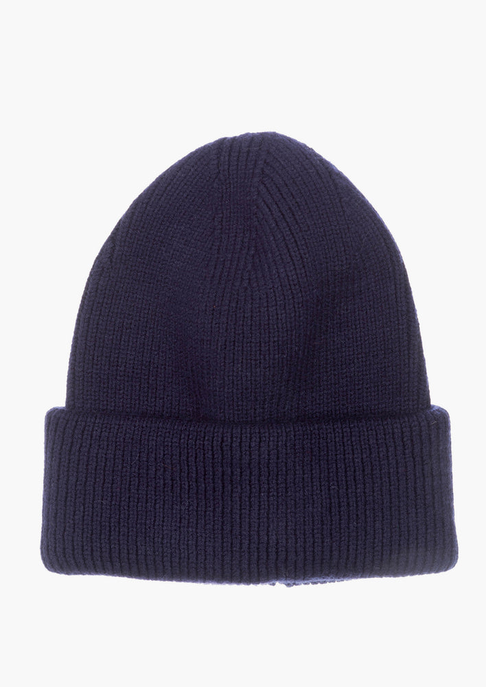 A knit beanie with oversized cuff in navy color.