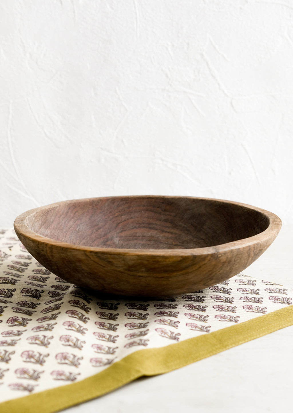 2: A carved olivewood bowl.