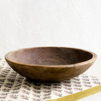 2: A carved olivewood bowl.
