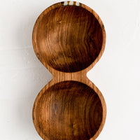 1: A double well wooden bowl with small bone detailing.