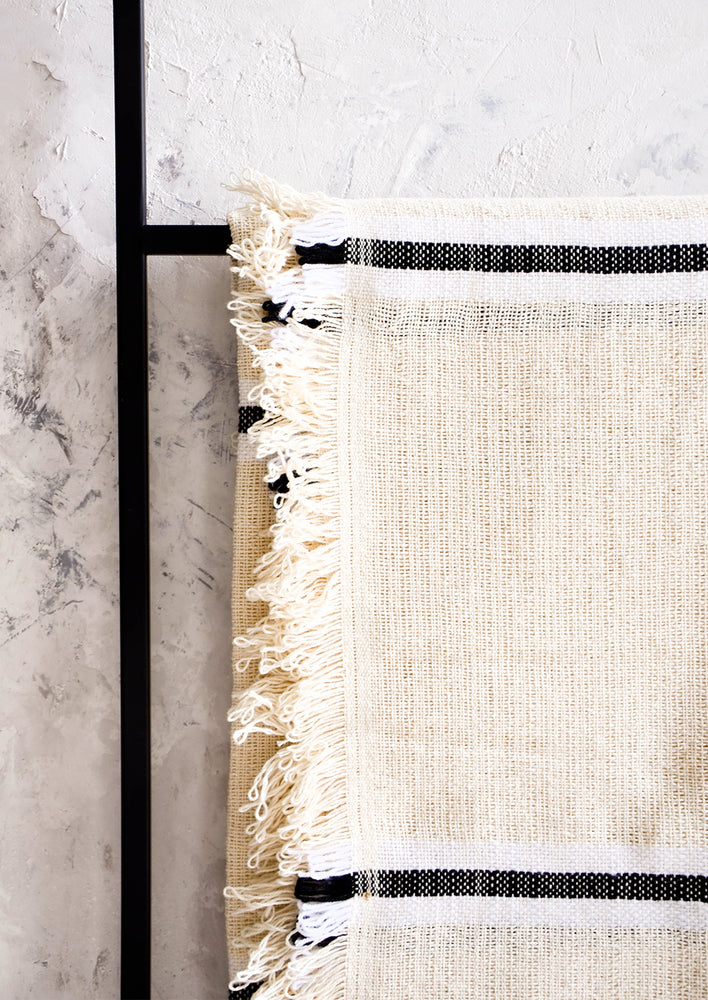 2: Looped, fringed edge trim on a raw cotton blanket