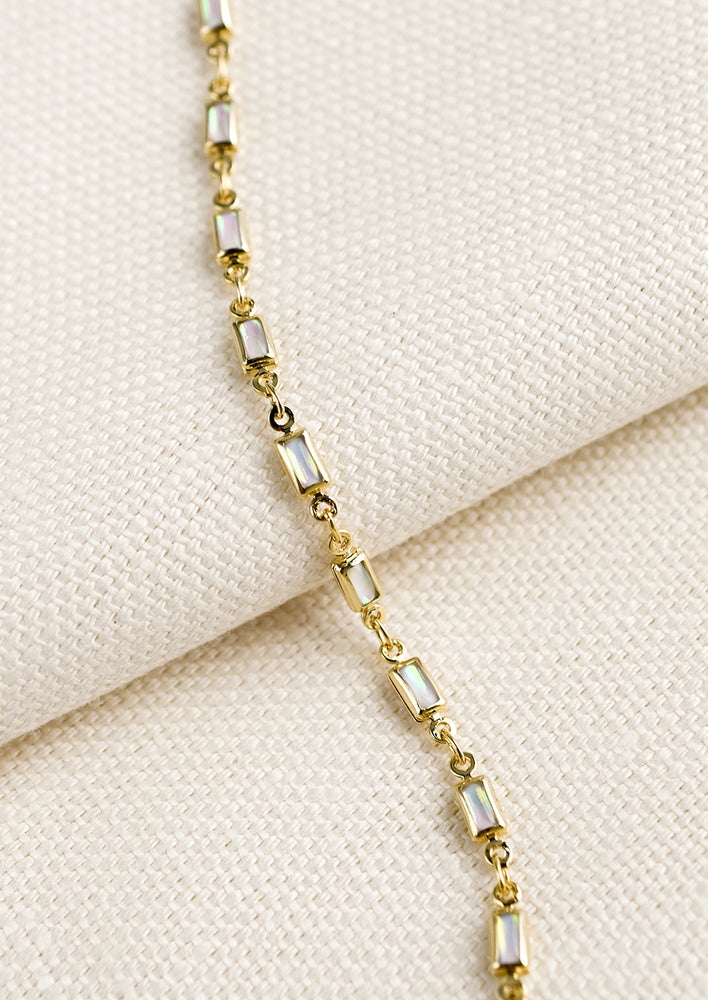 1: A gold bracelet with baguette shaped opals throughout.