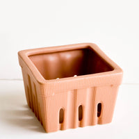 Clay: Ceramic basket in the style of disposable berry basket, shown in reddish brown