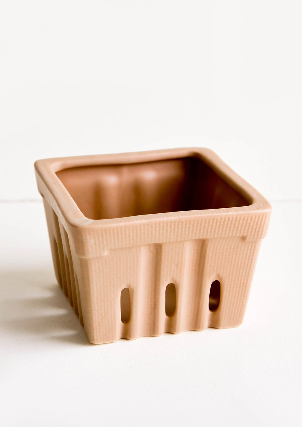 Cocoa: Ceramic basket in the style of disposable berry basket, shown in cocoa brown