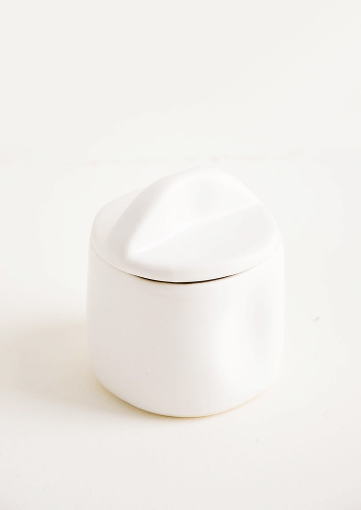 Snow: A white ceramic jar with lid.