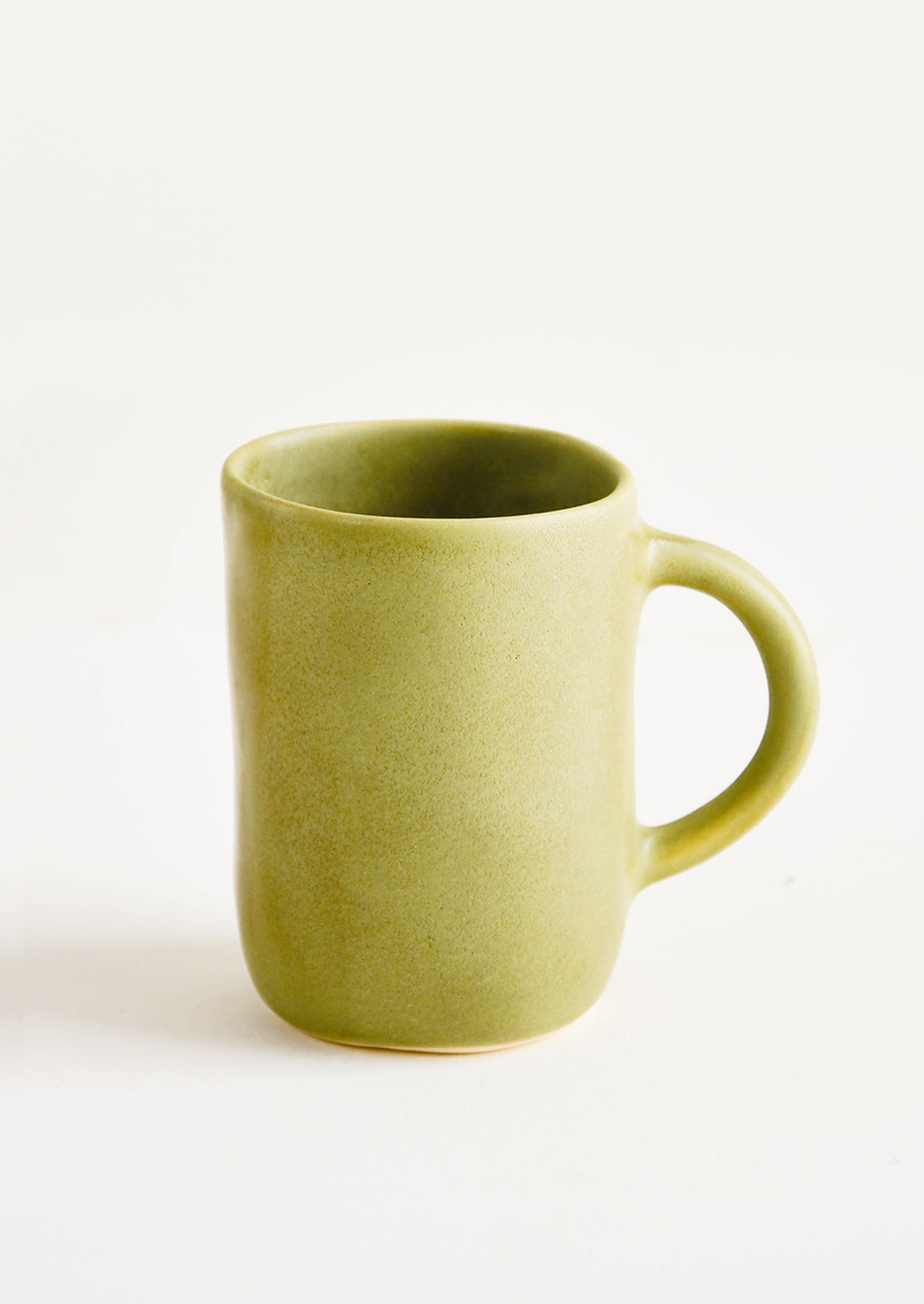 Avocado: Ceramic mug with handle, shown in matte avocado green glaze.