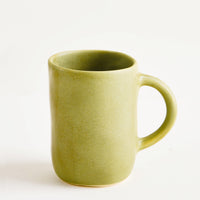 Avocado: Ceramic mug with handle, shown in matte avocado green glaze.