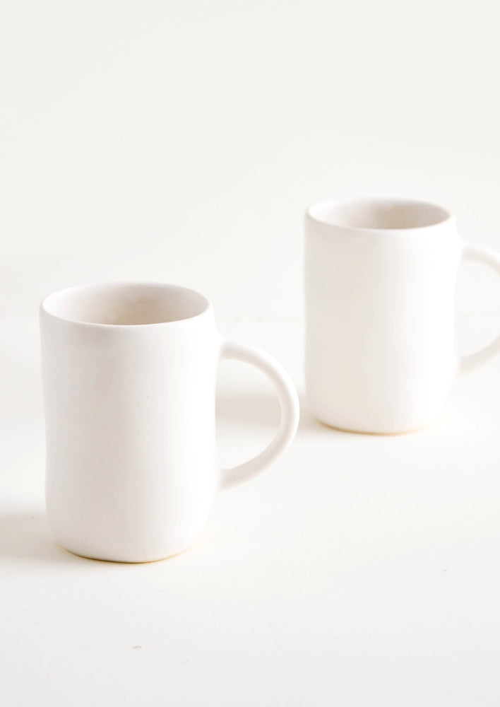 4: Ceramic mugs with handle in matte white glaze.