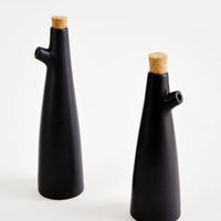 Small / Black: Ceramic cruets for oil & vinegar, one taller than the other. Matte black glaze, cork stopper as lid.