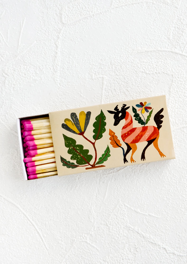 Matchbox printed with otomi textile inspired pattern, housing long matches with pink tips