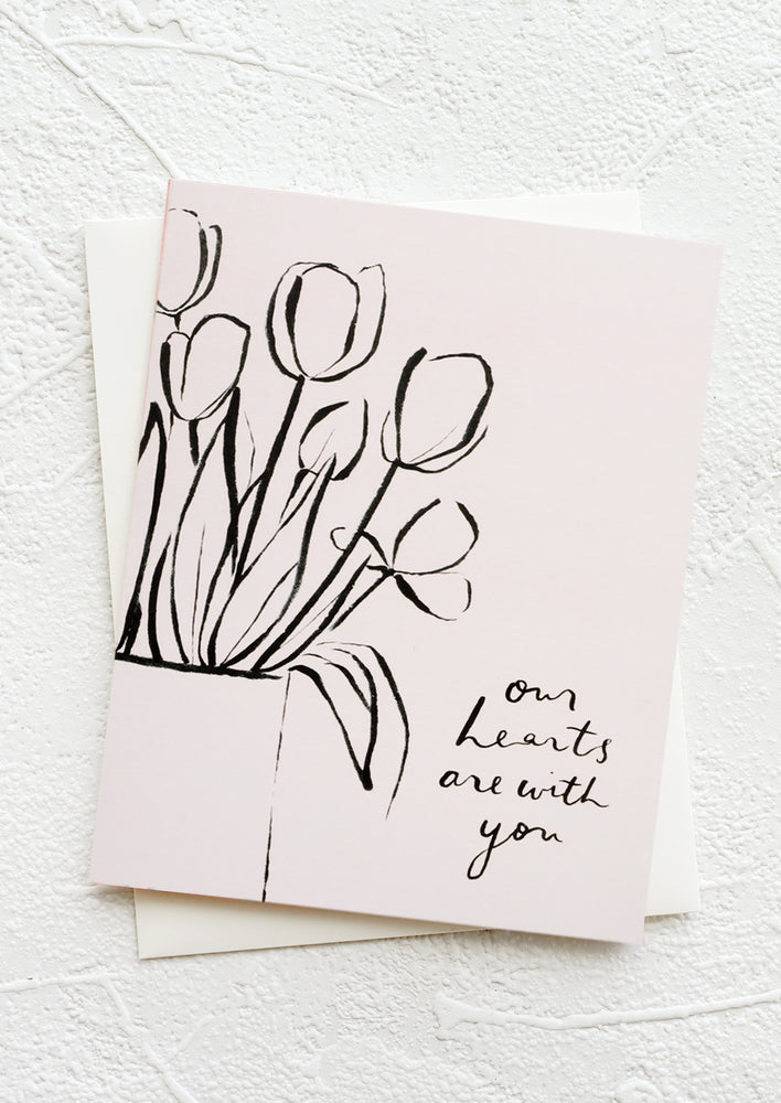 A greeting card featuring drawing of tulips and text reading "Our hearts are with you".