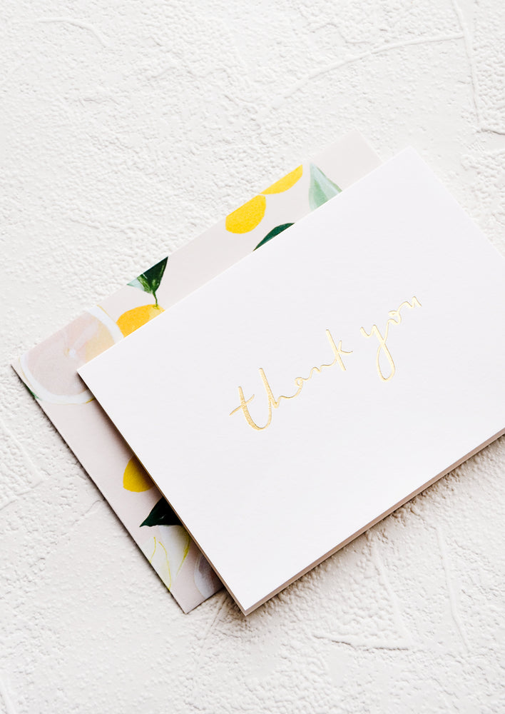 4: White greeting card with "Thank you" in gold script and citrus patterned envelope