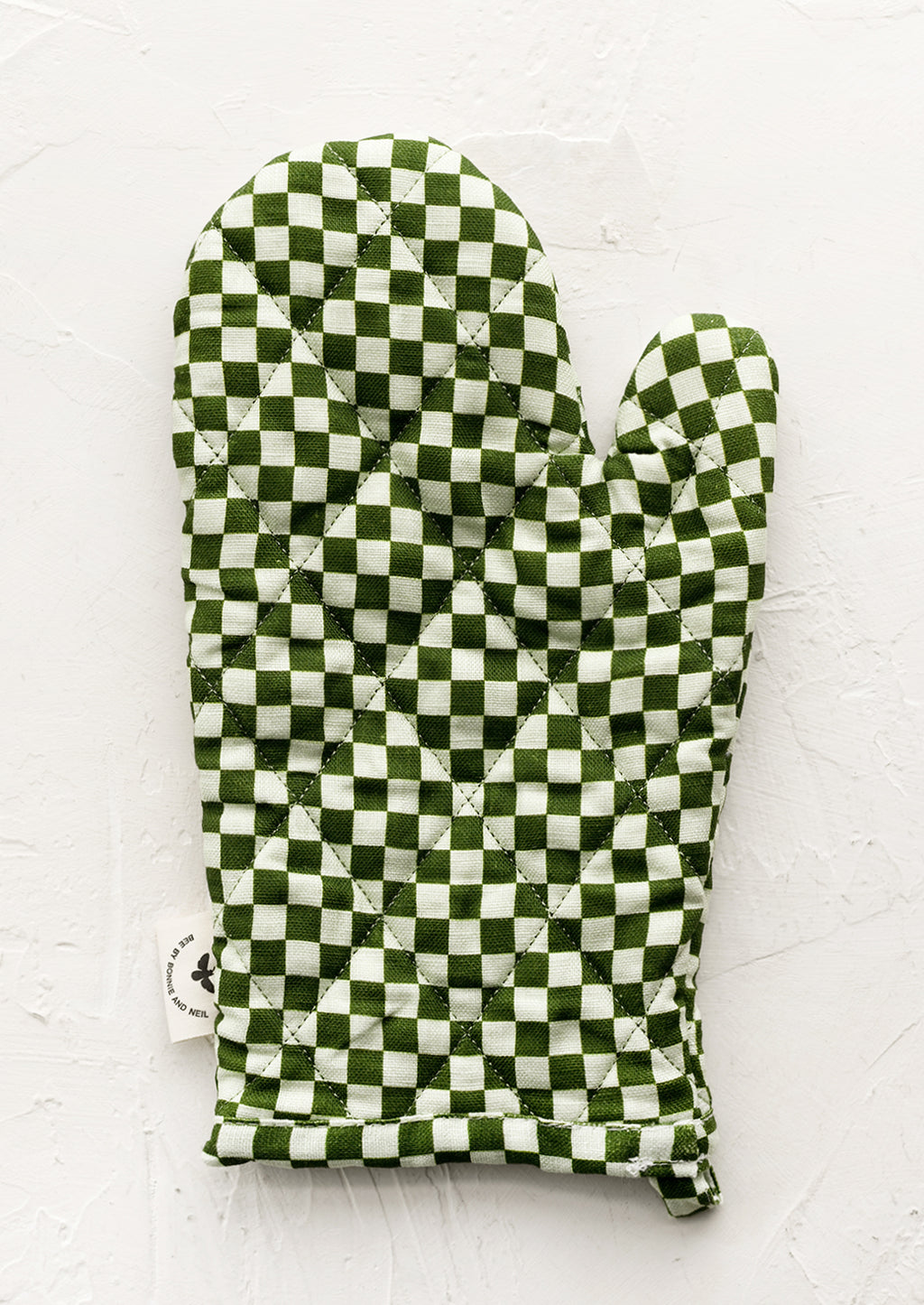 Green: A quilted oven mitt in two tone green checker print.