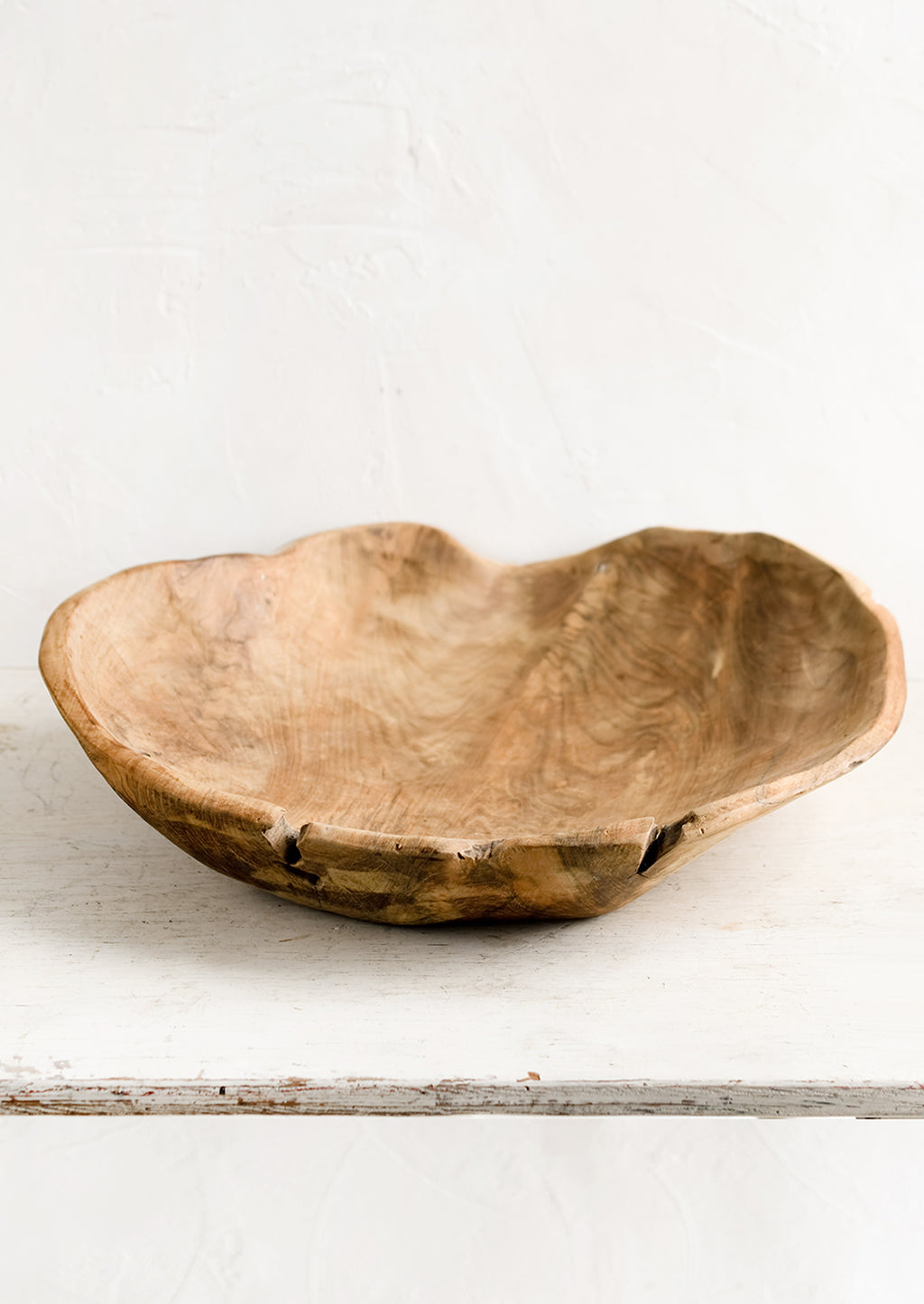 1: A large teak wood bowl with natural cracks and fissures.