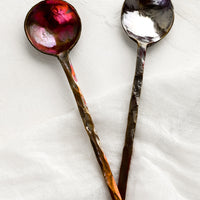 Classic: Oxidized metal spoons with varied oil-slick finish.