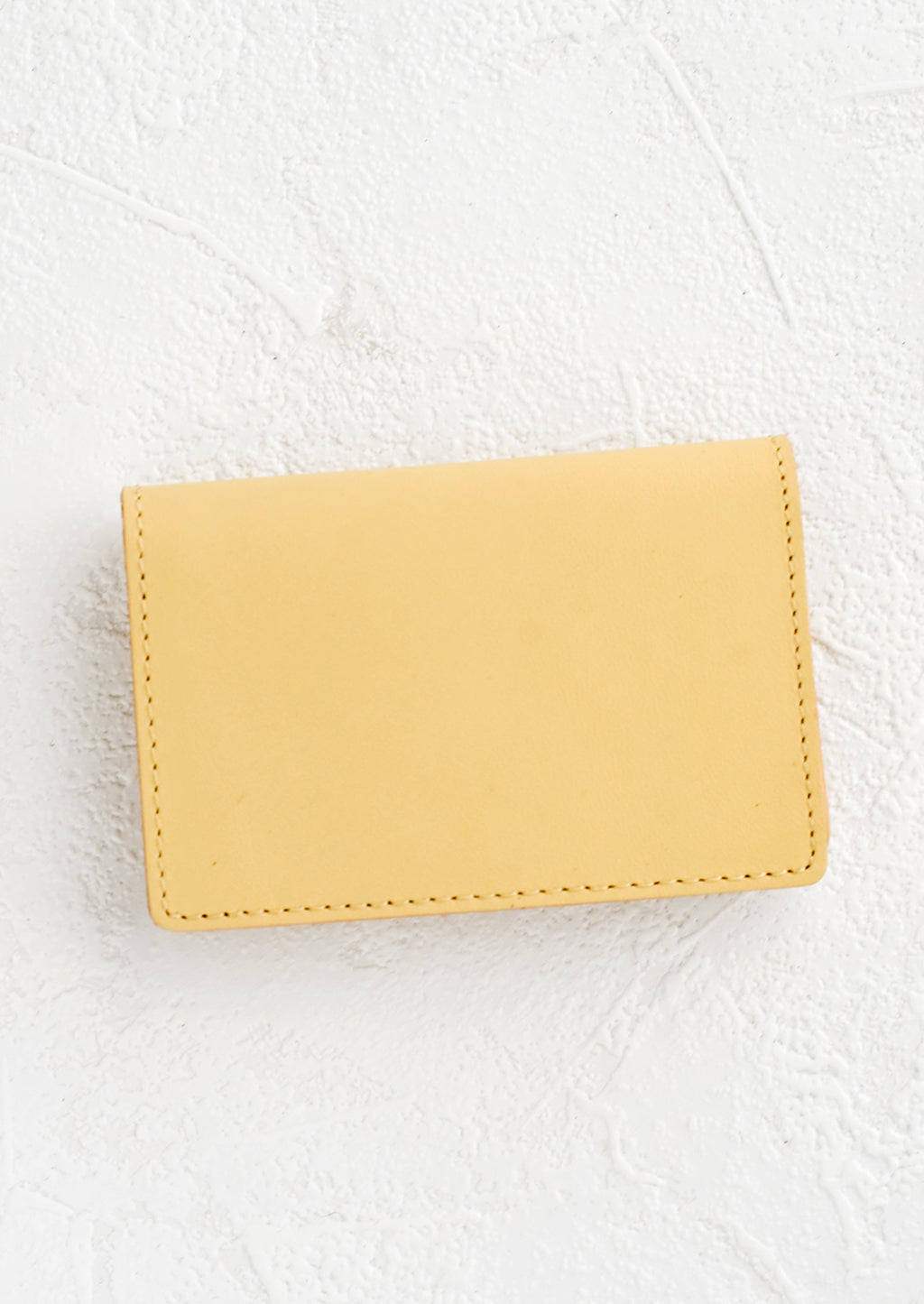 Vanilla: A small leather cardholder wallet in vanilla.