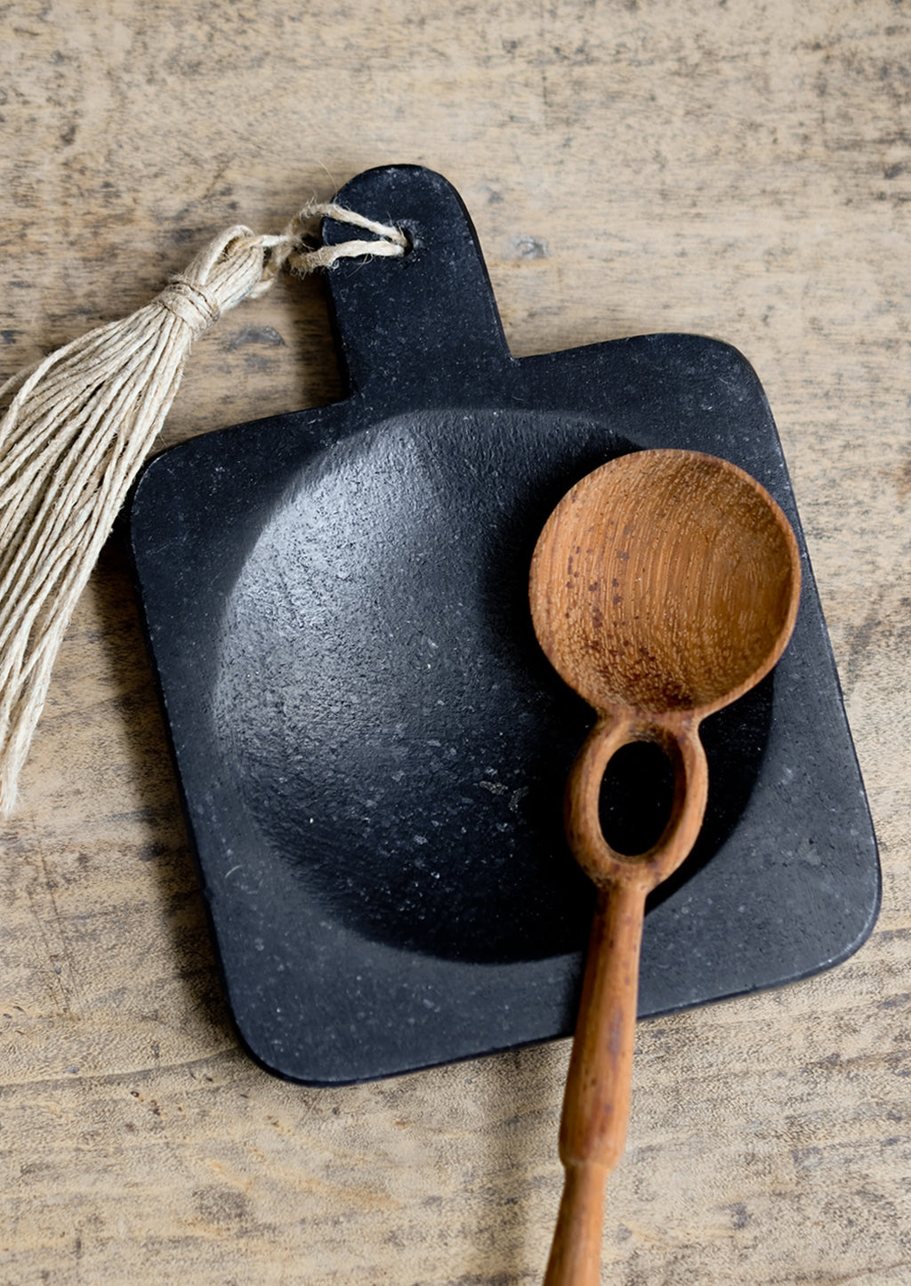 2: A paddle shaped marble spoon rest in black.