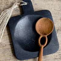 2: A paddle shaped marble spoon rest in black.