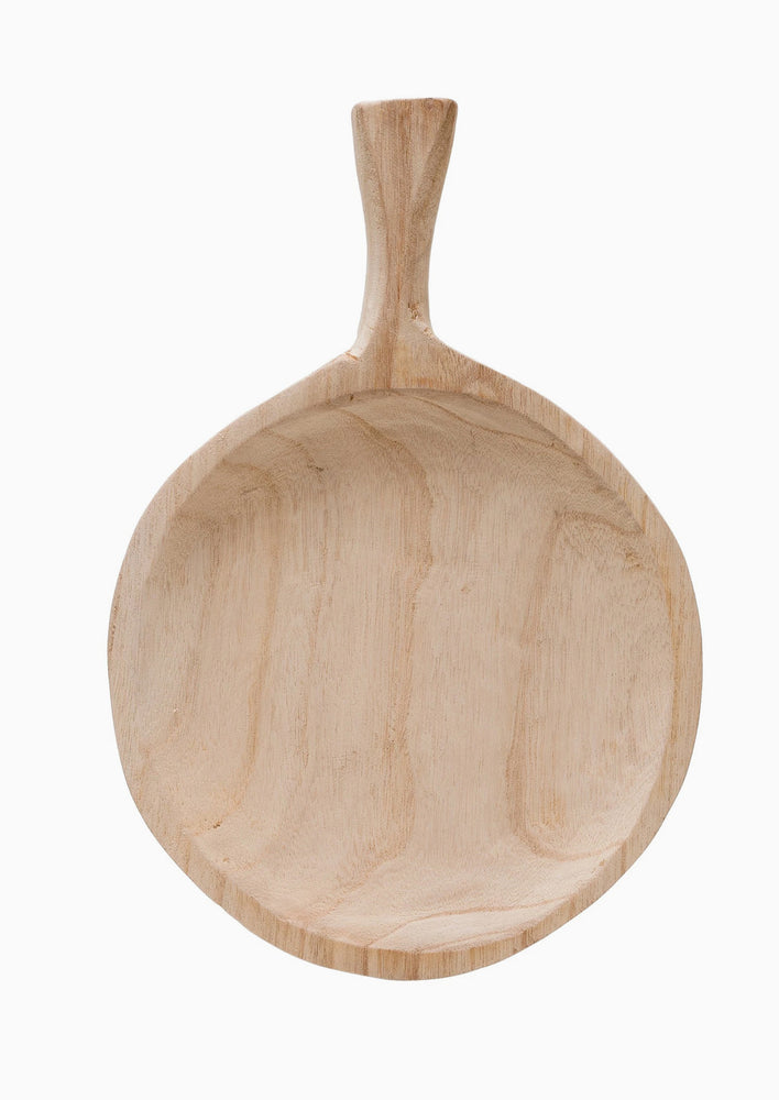 2: A round paddle shaped tray in natural paulownia wood.