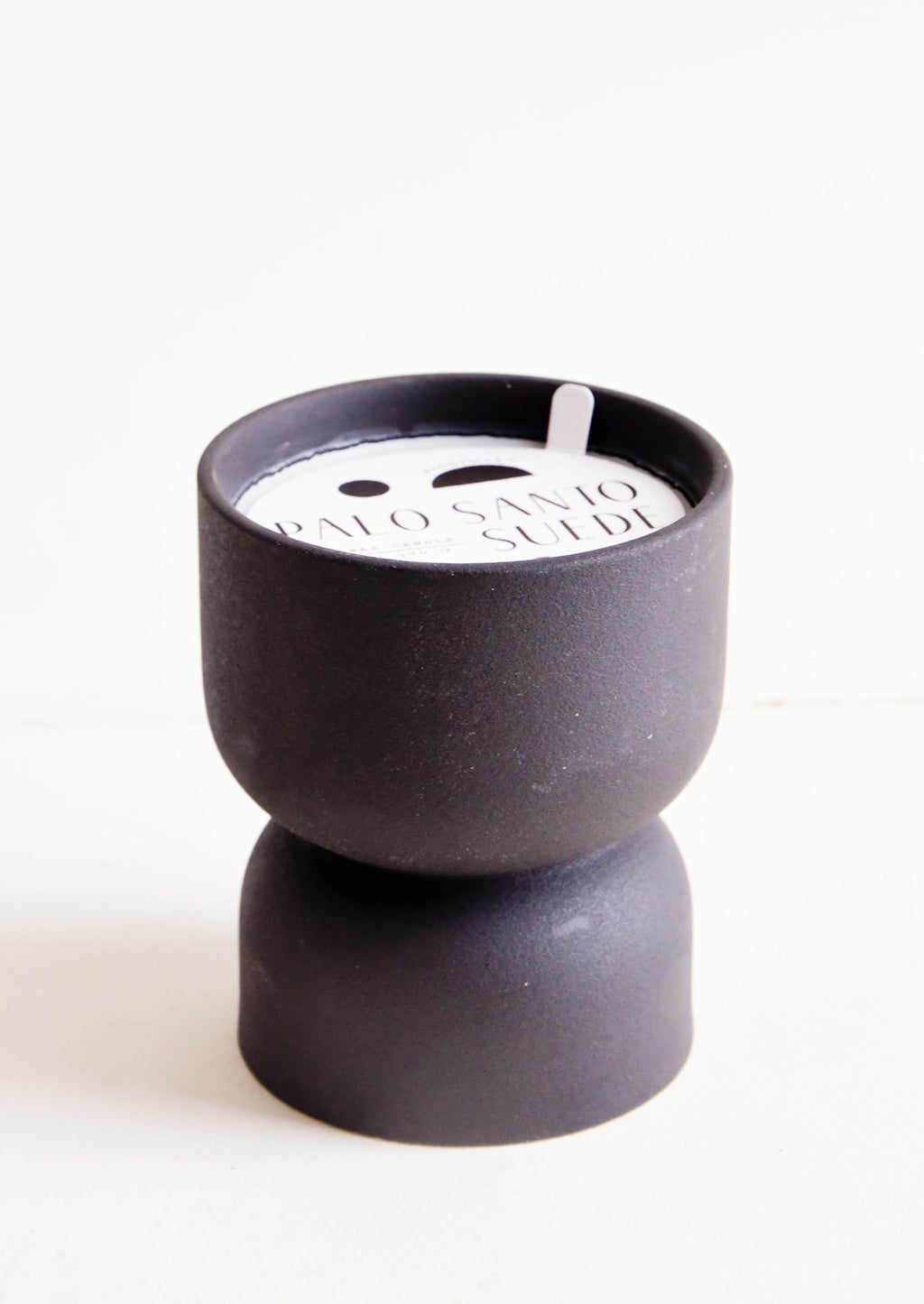 Palo Santo & Suede: Scented candle in hourglass-shaped matte ceramic containers in black