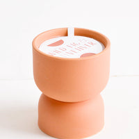 Wild Fig & Vetiver: Scented candle in hourglass-shaped matte ceramic containers in terracotta