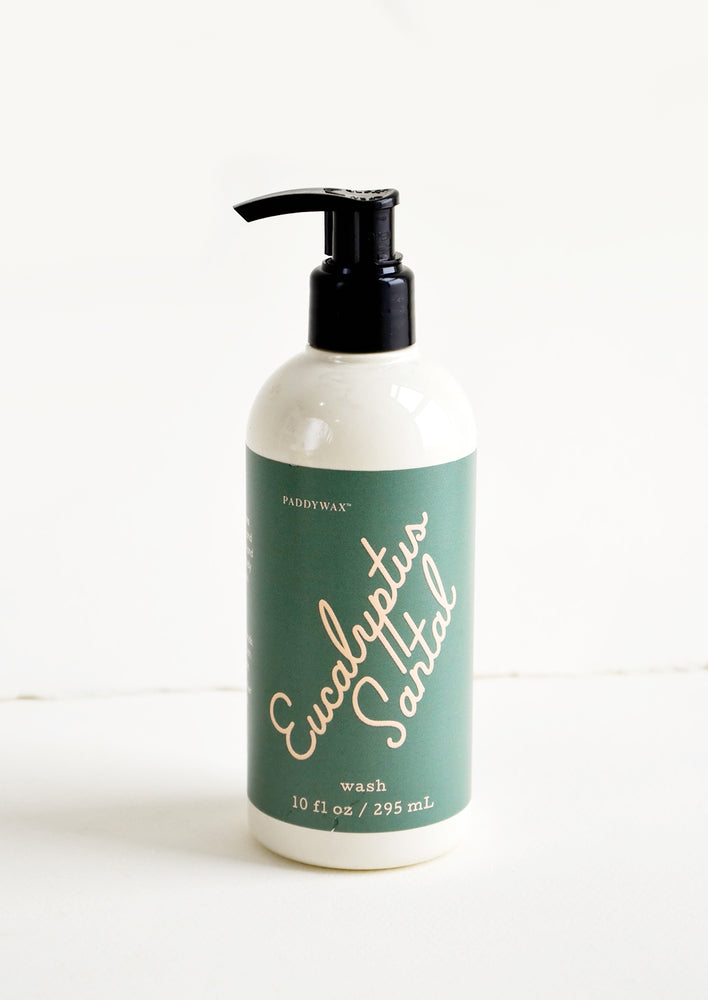 Liquid soap packaged in ivory and black pump bottles with pink and dark green label