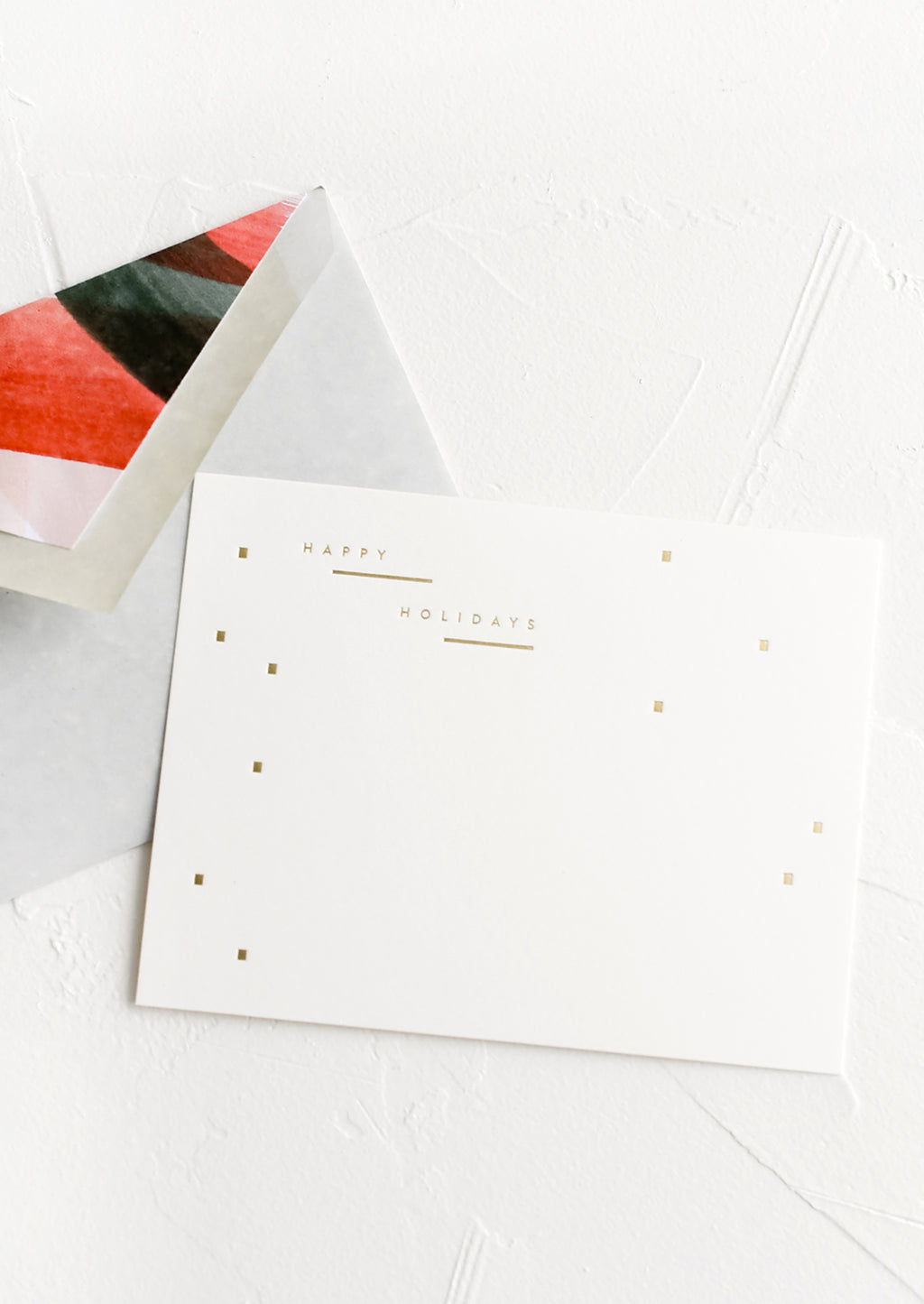 2: A set of holiday notecards with painted red and green envelope liners.