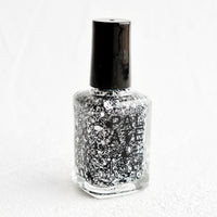 Cookies & Cream: A bottle of nail polish in black and white glitter.
